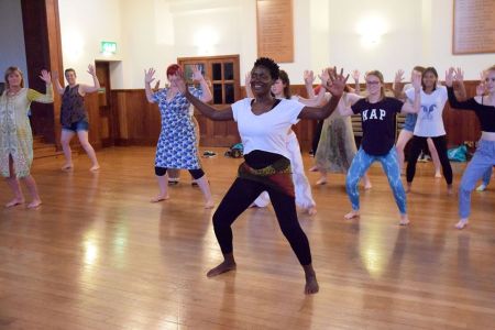 A group of women, learning how to 'kossa' - and having fun!